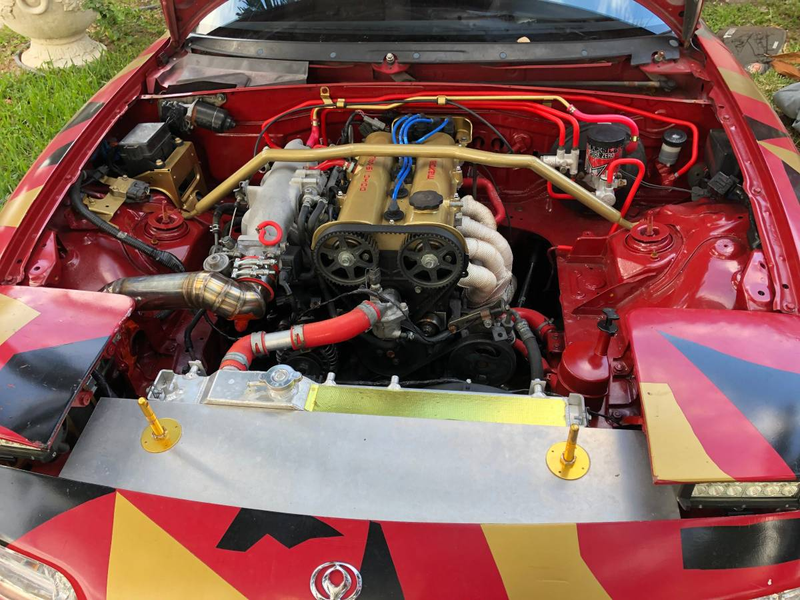 Illustration for article titled At $2,500, Is This Custom 1992 Mazda MX-5 Miata a Book You Don’t Judge by its Cover?